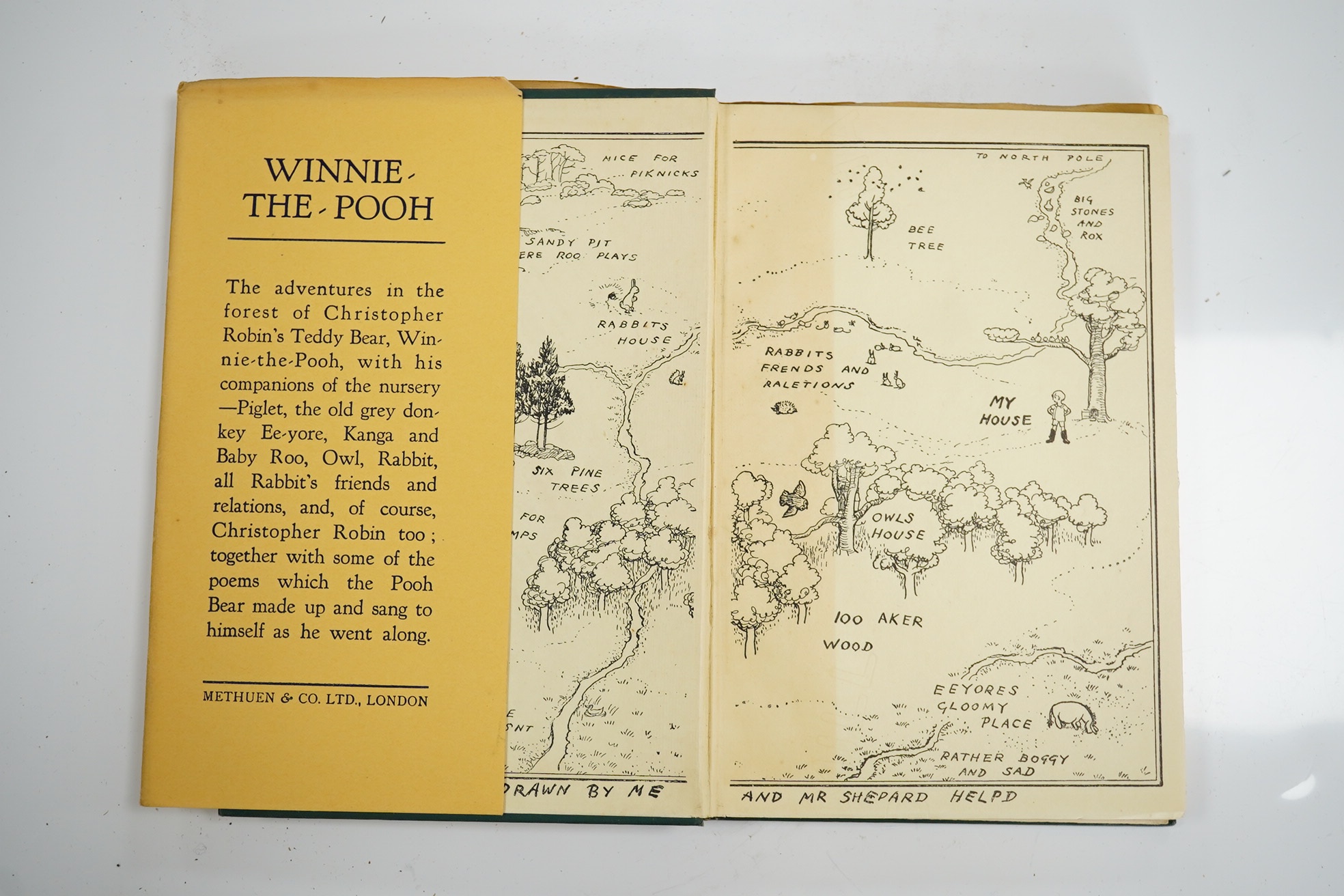 Milne, A. A. - Winnie-the-Pooh, decorations by E. H. Shepard. London: 1st edition, 1st impression, 8vo, original green pictorial cloth gilt, top edge gilt, pictorial endpapers, illustrations throughout the text, dust jac